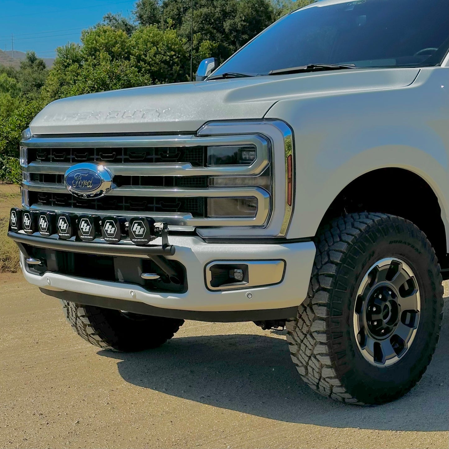 2017 - 2024 Ford Super Duty Light Mount - The "Low Pro" Series featuring a Baja Designs 40" Curved OnX6 Arc Mount Tabs