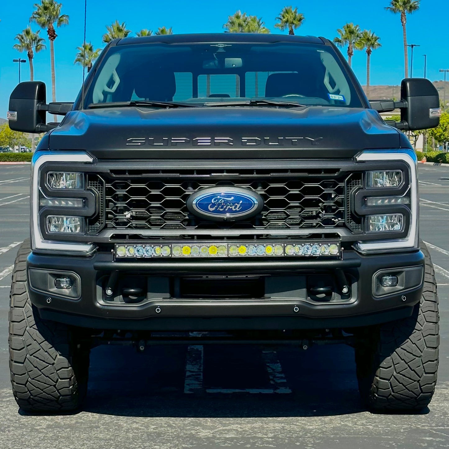 2017 - 2024 Ford Super Duty Light Mount - The "Low Pro" Series featuring a Baja Designs 40" Curved OnX6 Arc Mount Tabs