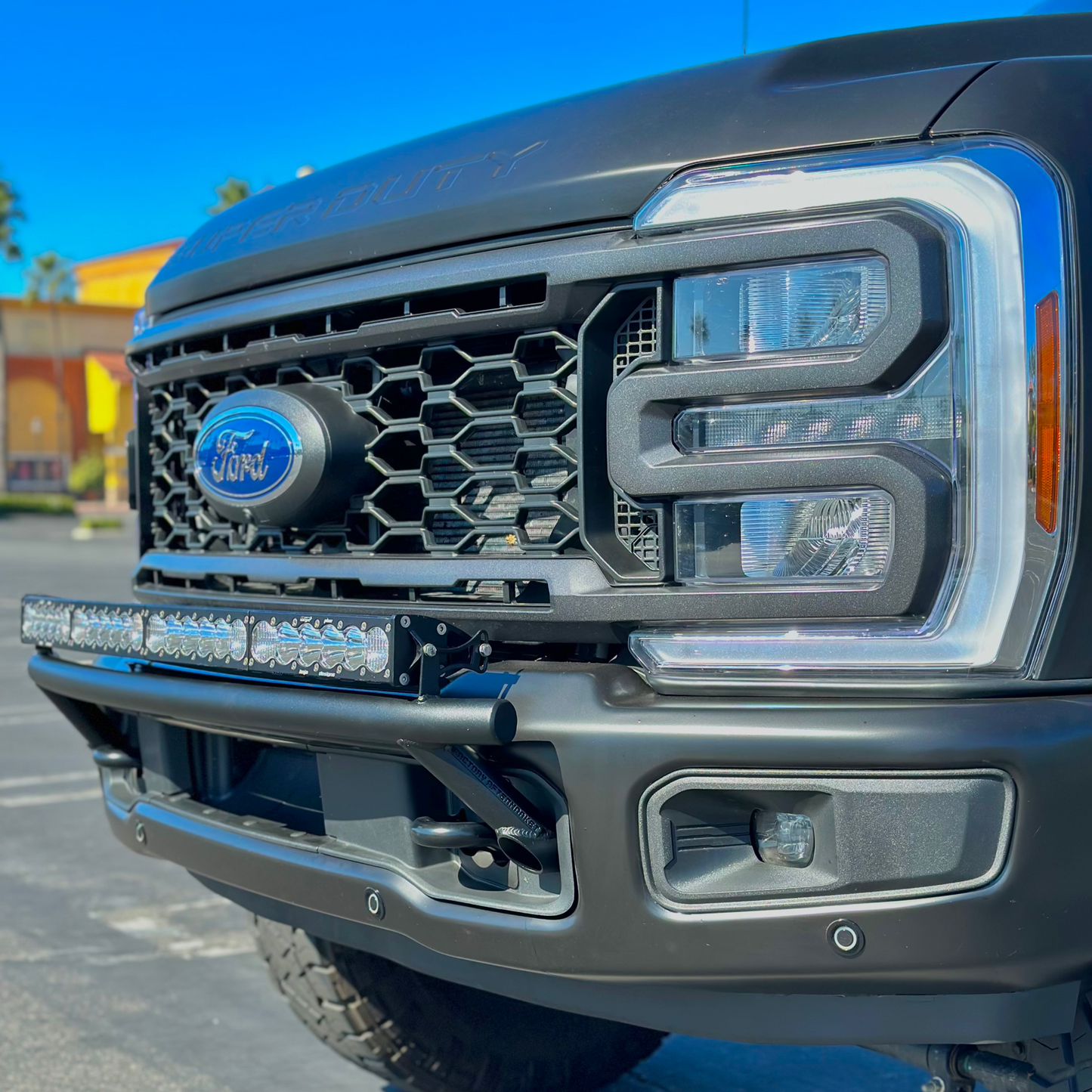 2017 - 2024 Ford Super Duty Light Mount - The "Low Pro" Series featuring a Baja Designs 40" Curved OnX6 Arc Mount Tabs