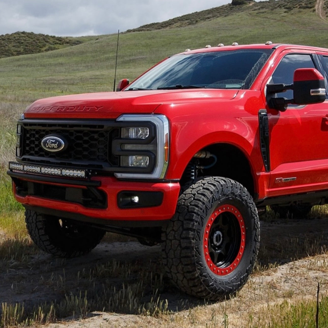 2017 -2026  Ford Super Duty Light Mount - The "Low Pro" Series featuring a Baja Designs 40" Curved OnX6 Arc Mount Tabs