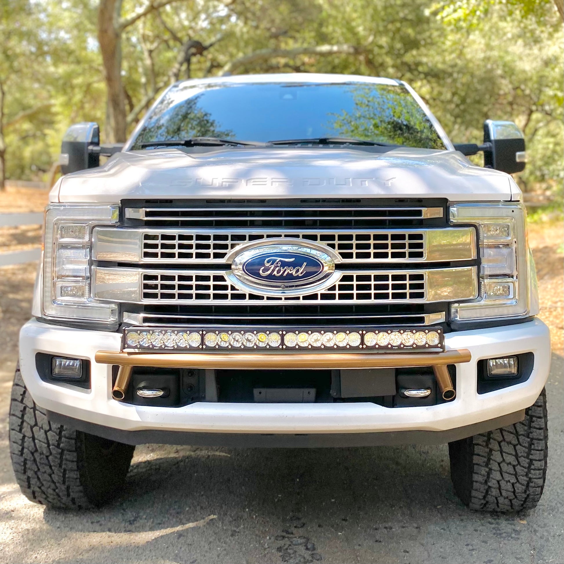 2017 - 2023 Ford Super Duty Light Mount - The Low Pro Series featuring a  Baja Designs 40 Curved OnX6 Arc Mount Tabs